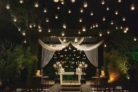 02 floating candle holders over the whole space and on the wedding arch