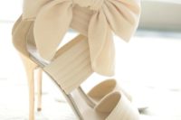 02 strappy cream high heels with oversized ribbon bows on the ankles