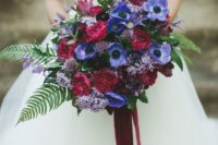 02 violet and fuchsia flowers and green leaves make this bouquet eye-catching