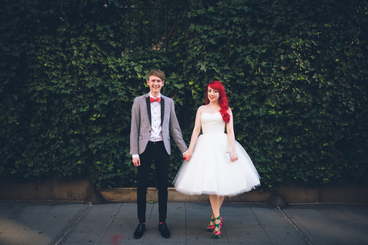 She was also rocking a short strapless wedding dress with a tulle skirt and red hair