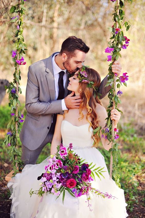 a bold swing with greenery and purple blooms