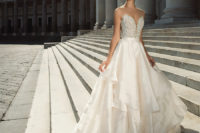 03 gorgeous ballgown with a lace applique embroidered strapless bodice and a ruffled layered skirt with a train