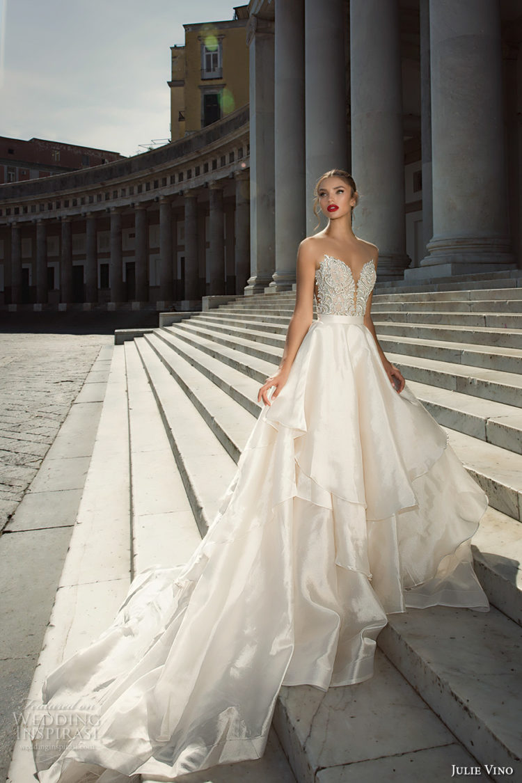 gorgeous ballgown with a lace applique embroidered strapless bodice and a ruffled layered skirt with a train