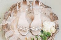 Metallic heeled sandals with straps and beautiful large rhinestones