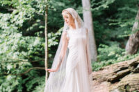 04 The bride was wearing a Carol Hannah gown with lace appliques and jeweled cap sleeves, a long veil