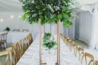 04 textural greenery centerpieces on tall copper stands