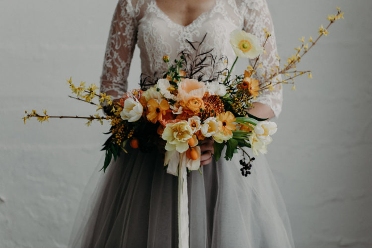 I totally love her orange-tinted textural bouquet with ribbons