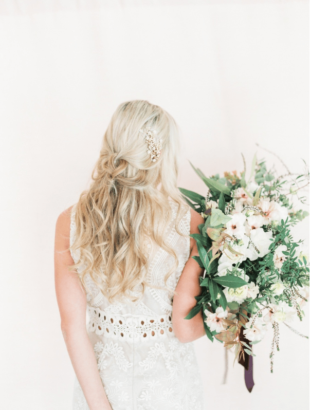 The bride was wearing two different dresses by BHLDN and various headpieces and hair pins