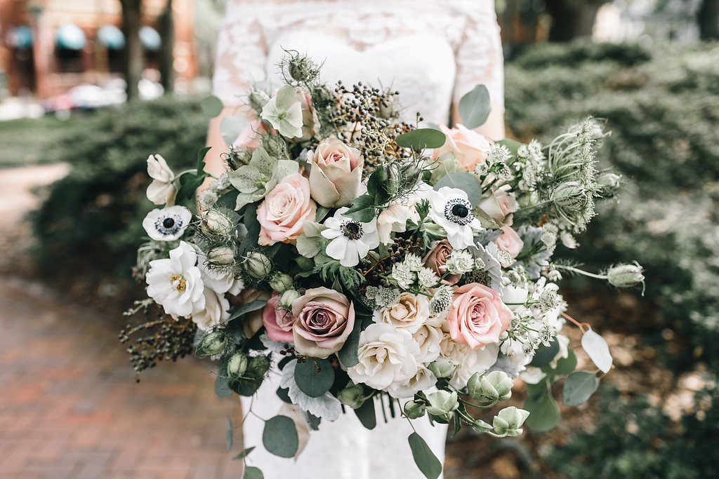 The wedding bouquet was textural, pale green, white and blush - pure elegance as it is
