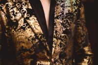 05 This is one of the groom’s looks with a black shirt and a gold patterned jacket