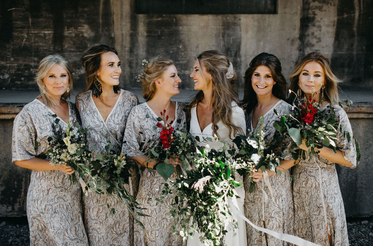 The bridesmaids were wearing V neck printed grey dresses