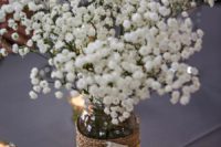 06 a jar wrapped with burlap and with a fabric flower and baby’s breath