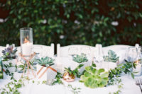 07 The table setting was done with textural greenery and large succulents to give the table a modern look