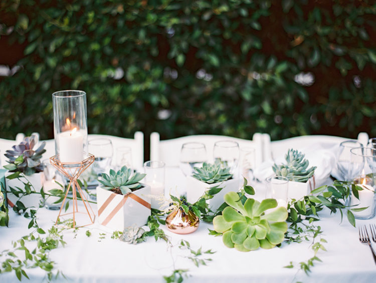 The table setting was done with textural greenery and large succulents to give the table a modern look