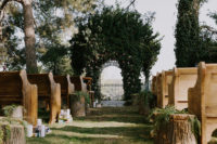 07 There was a garden ceremony with a stunning iron gazebo covered with greenery and rustic aisle decor