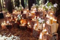 07 a tree stump altar with candles all over and some blooms