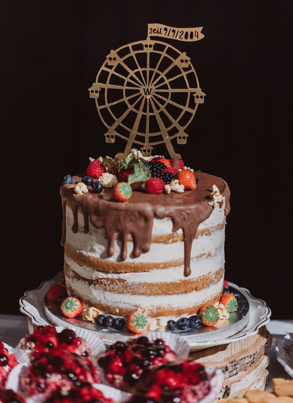 The wedding cake was a naked one with chocolate drip and topped with fresh berries