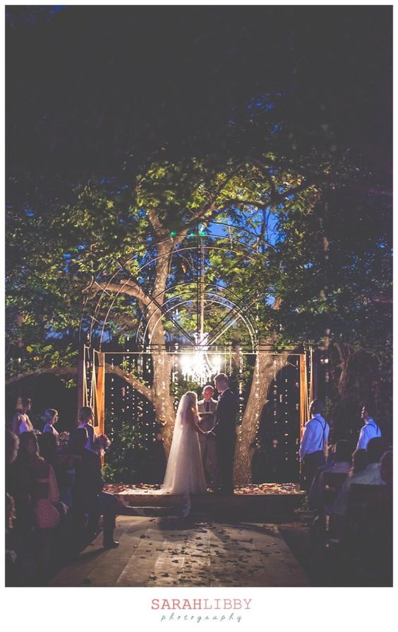 a glam chandelier and some string lights for the wedding altar
