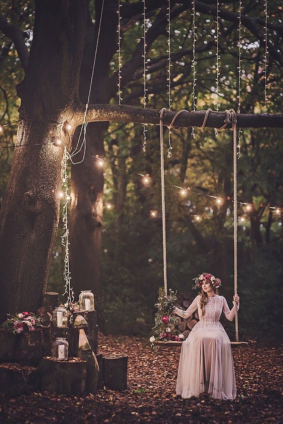 a simple rope swing with some bold blooms and herbs