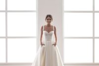 08 modern wedding dress in cream with a bustier and a full skirt with pockets