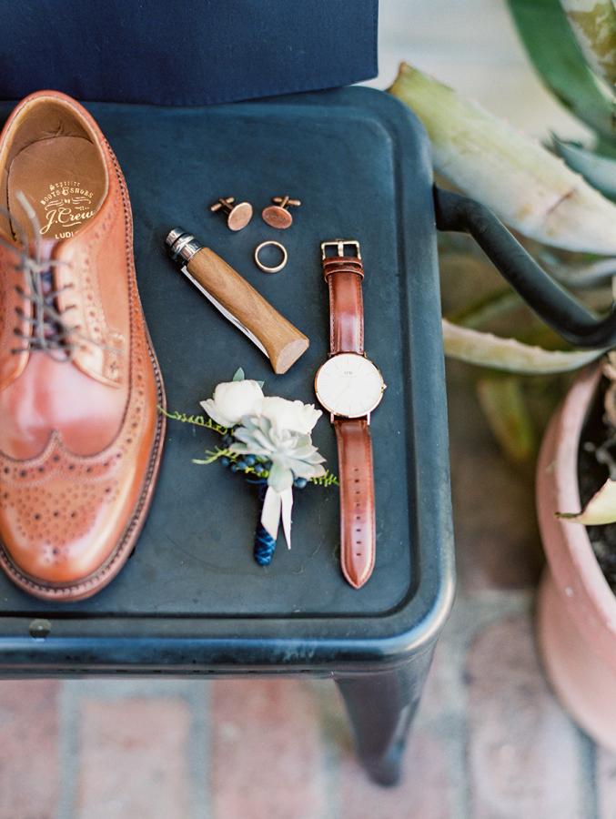 The groom opted for brown and copper accessories for a chic look