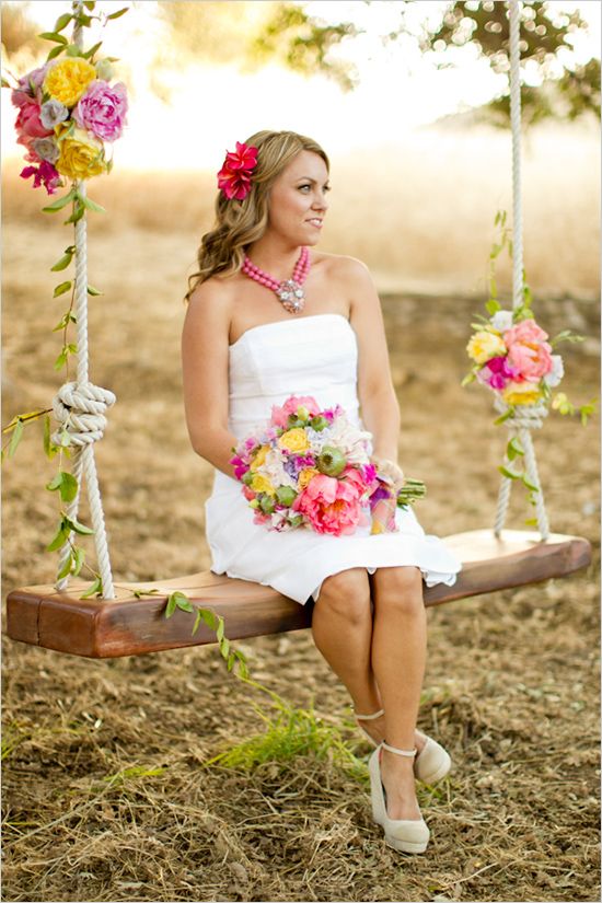 a rustic swing with bold blooms and some leaves