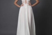 illusion plunging neckline wedding dress with a lace bodice and a flowy silk skirt