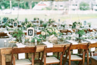 10 The tablescapes were simple and fresh, with a lot of greenery and neutral blooms and chalkboard table numbers