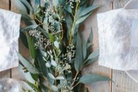 11 eucalyptus table runner with candles for a rustic tablescape