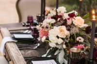 12 boho rustic table with a dramatic color palette and dark candles