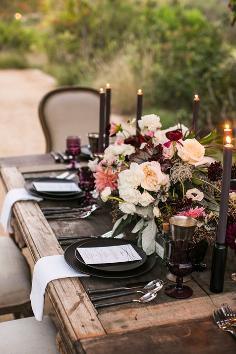 boho rustic table with a dramatic color palette and dark candles