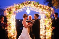 12 super shiny wedding arch with flowers will illuminate the space the best way possible