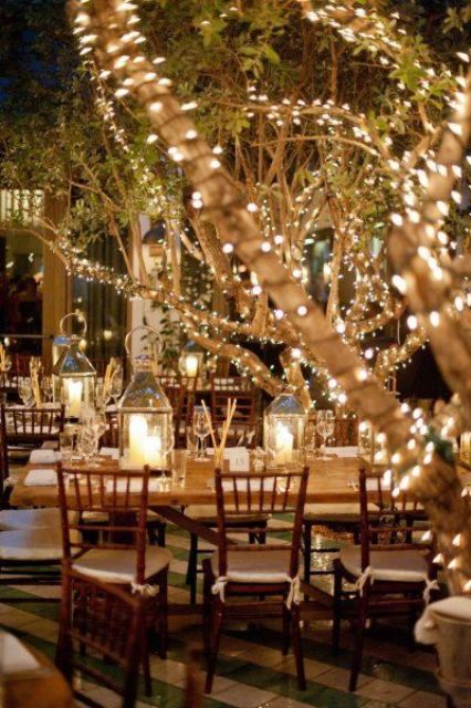 use the branches of the trees and bushes throughout the venue to attach string lights