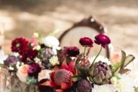 13 a box centerpiece with hot red, burgundy and dark purple elements