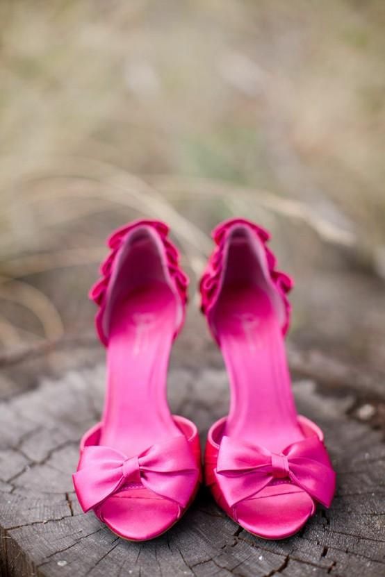 bold fuchsia peep toe heels with a ruffled back and bows on captoes