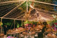 13 string lights attached over the reception as a tent look chic