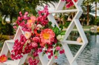 14 white triangle wedding backdrop with lush bold pink and fuchsia flowers