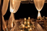 15 illuminate your reception with candles and string lights over it for a romantic feel