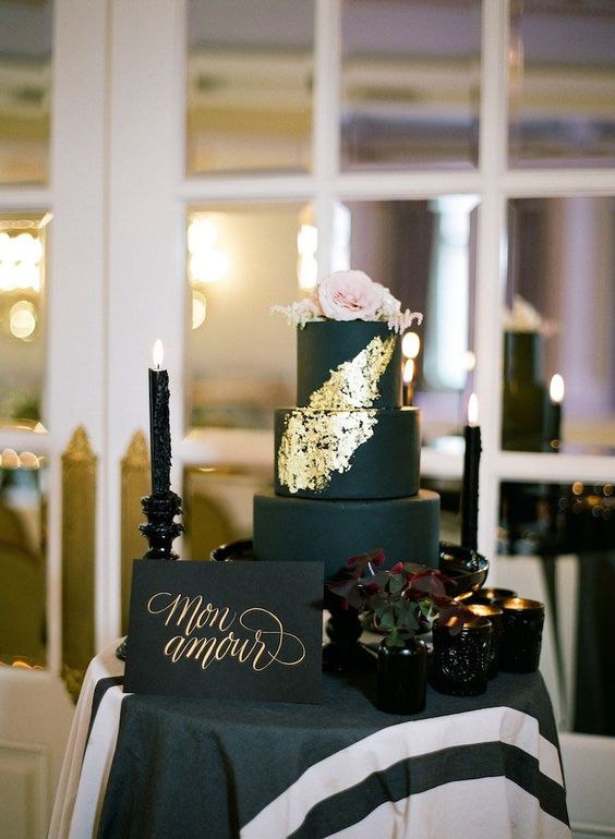 matte black wedding cake with gold touches and blush roses