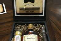 16 a cool box with cigars, Hennessy and Ferrero Rocher to spoil your friend