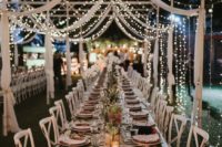 16 fabric stripes and light strings over the reception create a tent shape