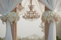 16 large glam chandeliers over the ceremony space