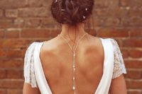 17 pearl drop back necklace highlights the open back