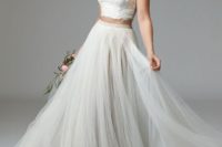 18 flowy tulle grey skirt and a neutral lace halter neckline crop top