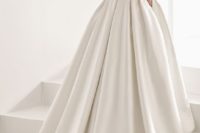 19 ballgown with a lace back and a plain skirt with a train and pockets