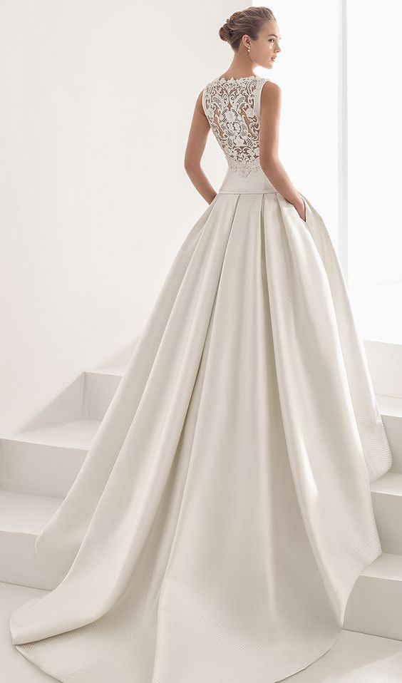 ballgown with a lace back and a plain skirt with a train and pockets
