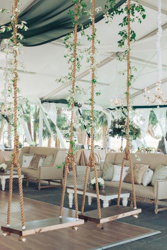 hang some whimsical wooden swings in the reception area and decorate them with greenery