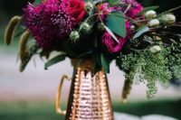 20 fuchsia and emerald wedding centerpiece in a copper pitcher