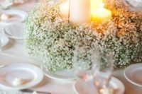 21 a baby’s breath wreath with candles in tall glass candle holders