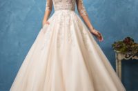 21 champagne-colored wedding dress with an illusion lace bodice with sleeves and lace appliques